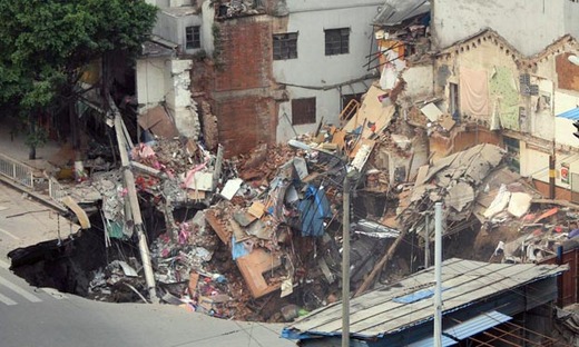 Massive Sinkhole in China Swallows Two Buildings